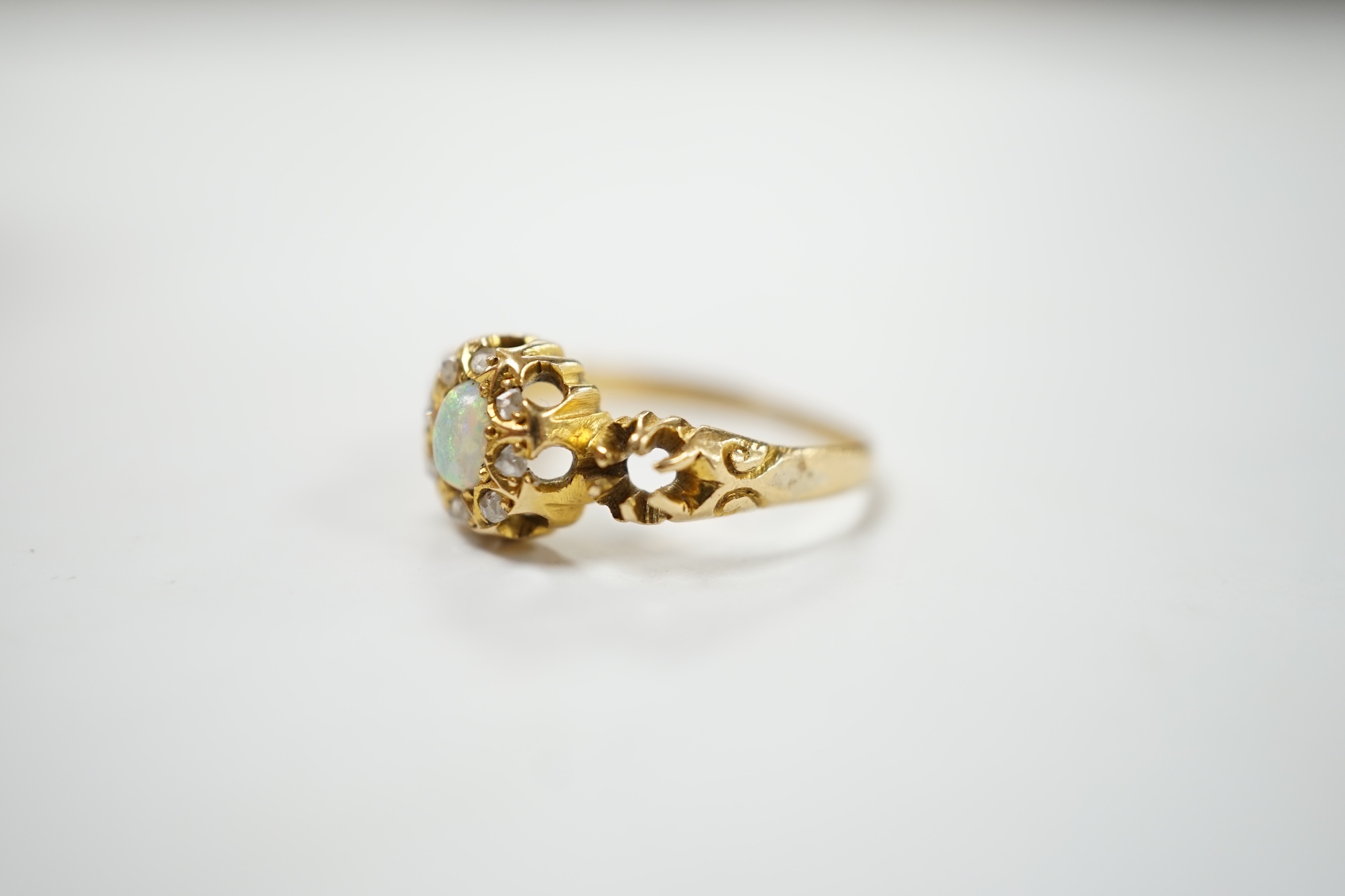 A late Victorian 18ct gold, white opal and diamond cluster set ring, size J, gross weight 2.3 grams. Condition - poor
